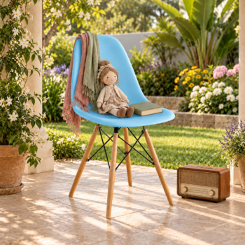 Modern sky blue molded plastic Eames style chair with natural wooden legs and black metal wire bracing set on a patio